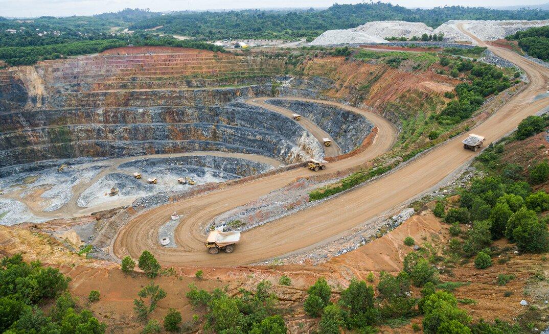 Mine-site preparation and technical personnel reviewing project plans